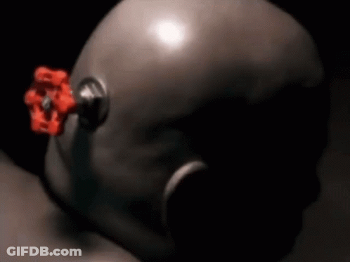 A Close Up Of A Helmet With A Red Valve On The Side GIF