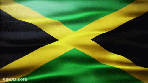A Close Up Of A Jamaican Flag With A Black Cross In The Middle GIF