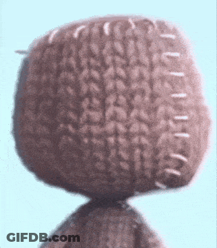 A Close Up Of A Knitted Object With White Stitching On It GIF