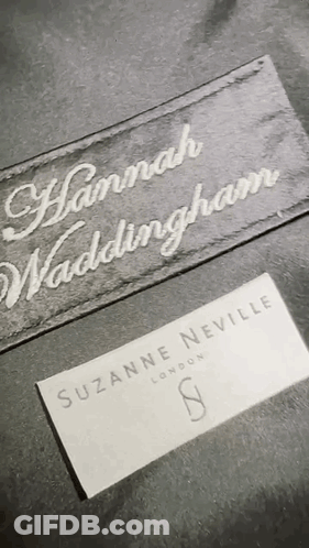 A Close Up Of A Label That Says Suzanne Neville London On It GIF