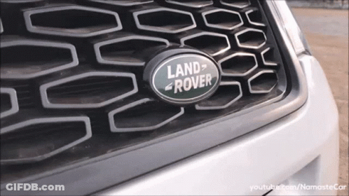 A Close Up Of A Land Rover Logo On The Grille GIF