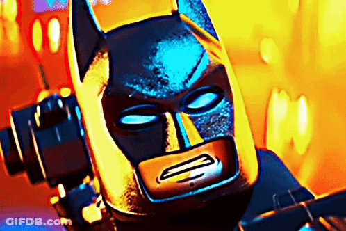 A Close Up Of A Lego Batman 'S Face GIF