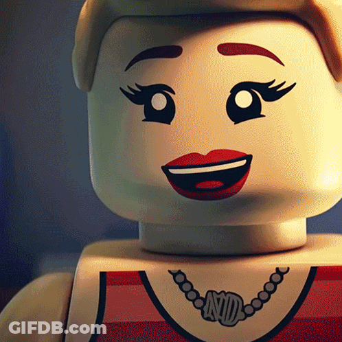 A Close Up Of A Lego Doll With A Necklace That Says Nd On It GIF