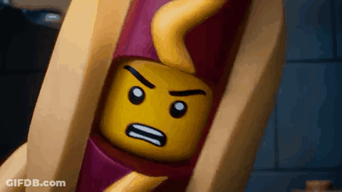 A Close Up Of A Lego Hot Dog With A Face On It GIF