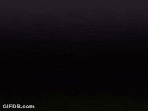 A Close Up Of A Letter M With A Black Background GIF