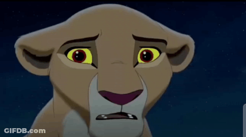A Close Up Of A Lion 'S Face With A Sad Look On It 'S Face . GIF