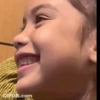 A Close Up Of A Little Girl 'S Face Smiling GIF