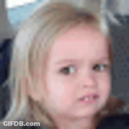 A Close Up Of A Little Girl 'S Face With Blonde Hair . GIF
