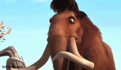 A Close Up Of A Mammoth 'S Face With Its Mouth Open GIF