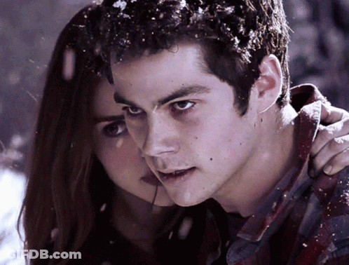A Close Up Of A Man And A Woman Looking At The Camera GIF