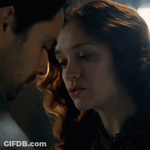 A Close Up Of A Man And A Woman Looking Into Each Other 'S Eyes With The Word Netflix Visible GIF