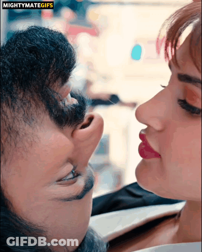 A Close Up Of A Man And Woman 'S Faces With The Words Mightymategifs Above GIF