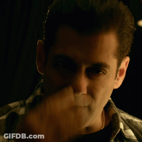 A Close Up Of A Man Covering His Face With His Hand GIF