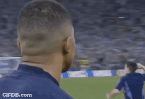 A Close Up Of A Man Covering His Face With His Hand . GIF