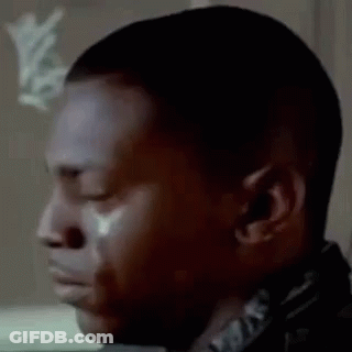 A Close Up Of A Man Crying With A Tear Coming Out Of His Eye . GIF