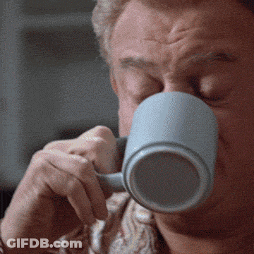 A Close Up Of A Man Drinking From A Mug GIF