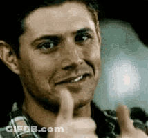 A Close Up Of A Man Giving A Thumbs Up Sign . GIF