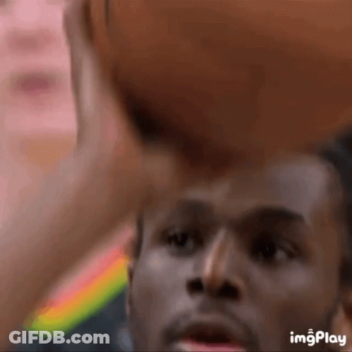 A Close Up Of A Man Holding A Basketball With The Words Imgplay Below GIF