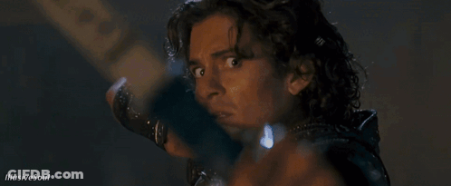 A Close Up Of A Man Holding A Bow And Arrow With Illusive Soul Written On The Bottom GIF