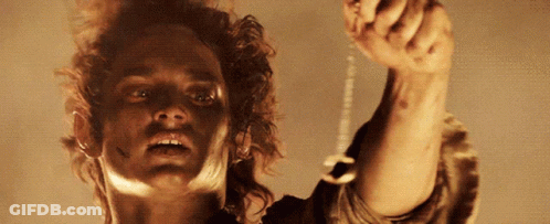 A Close Up Of A Man Holding A Key GIF