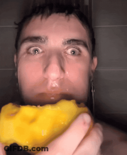 A Close Up Of A Man Holding A Yellow Object GIF