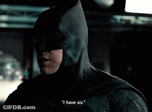 A Close Up Of A Man In A Batman Costume Says " I Have Six " GIF