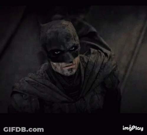 A Close Up Of A Man In A Batman Costume With A Caption That Says Imgplay GIF