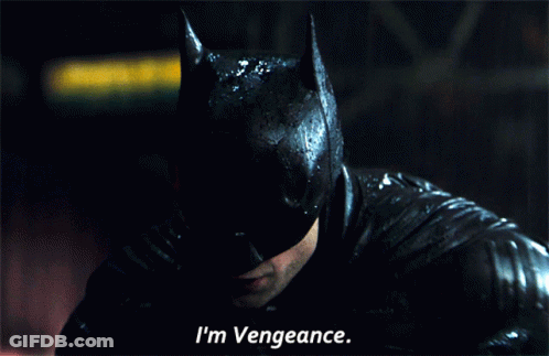 A Close Up Of A Man In A Batman Mask Saying I 'M Vengeance GIF