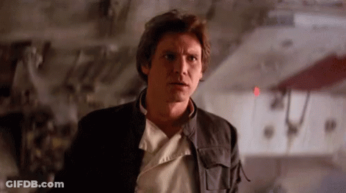 A Close Up Of A Man In A Black Jacket Standing In Front Of A Wall . GIF