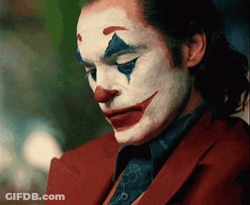 A Close Up Of A Man In A Clown Costume GIF