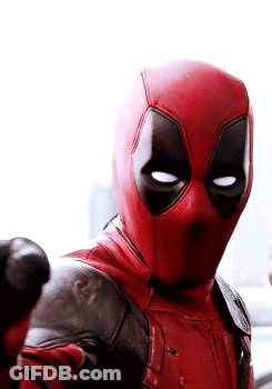 A Close Up Of A Man In A Deadpool Costume Giving A Thumbs Up . GIF