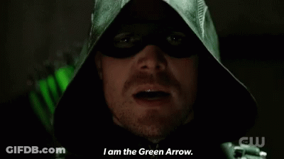 A Close Up Of A Man In A Green Hood Saying " I Am The Green Arrow " GIF