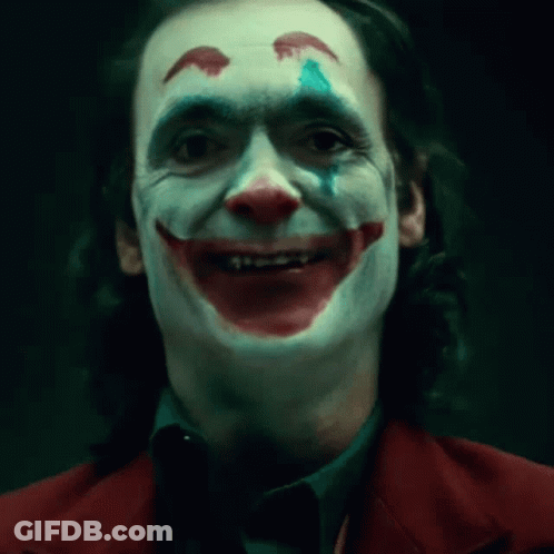 A Close Up Of A Man In A Joker Costume GIF