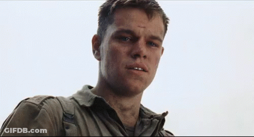 A Close Up Of A Man In A Military Uniform Looking At The Camera With A Serious Look On His Face . GIF
