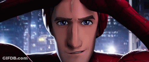 A Close Up Of A Man In A Spiderman Costume Covering His Face With His Hands . GIF