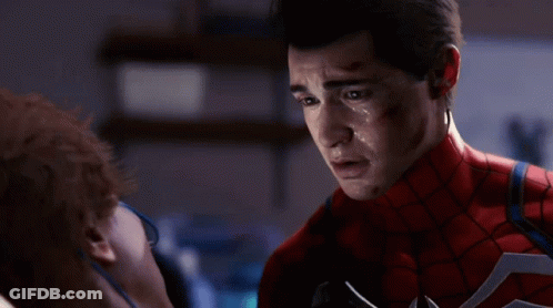 A Close Up Of A Man In A Spiderman Suit With Sweat On His Face GIF