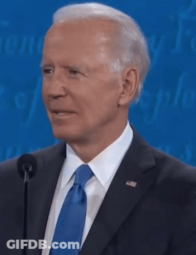 Close Up Of Man In Suit Speaking Into Microphone GIF