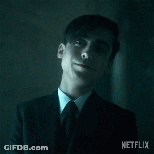 A Close Up Of A Man In A Suit And Tie With His Eyes Closed GIF