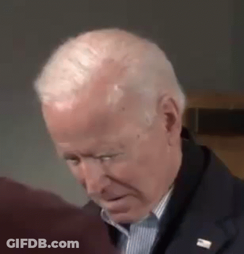 A Close Up Of A Man In A Suit Making A Face . GIF