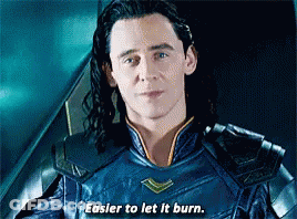 A Close Up Of A Man In A Superhero Costume With The Words `` Easier To Let It Burn '' . GIF