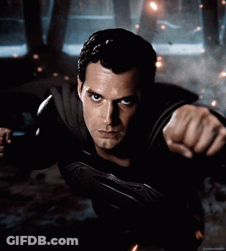 A Close Up Of A Man In A Superman Suit GIF