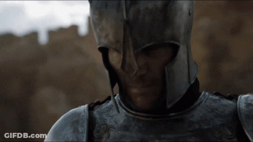 A Close Up Of A Man In Armor With A Helmet On GIF