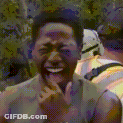 A Close Up Of A Man Laughing With A Stormtrooper In The Background GIF
