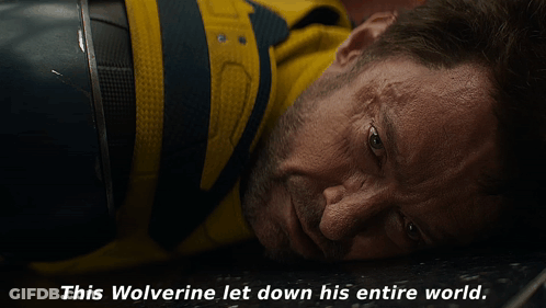A Close Up Of A Man Laying Down With The Words " This Wolverine Let Down His Entire World " Below Him GIF