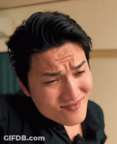 A Close Up Of A Man Making A Face With His Eyes Closed GIF