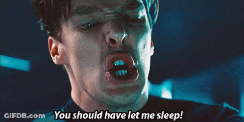 A Close Up Of A Man Making A Face With The Words You Should Have Let Me Sleep GIF