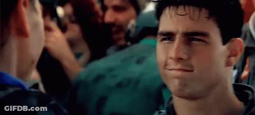 A Close Up Of A Man Making A Funny Face In A Crowd Of People . GIF