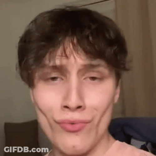 A Close Up Of A Man Making A Funny Face . GIF