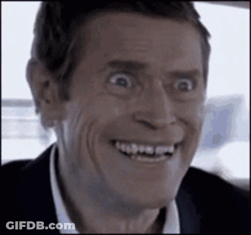A Close Up Of A Man Making A Funny Face While Smiling . GIF