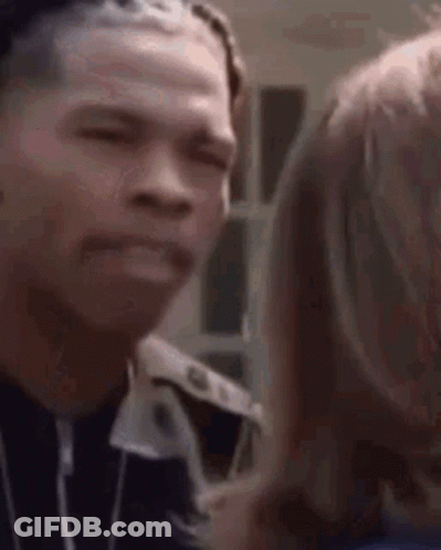 A Close Up Of A Man Making A Funny Face While Talking To Another Man . GIF
